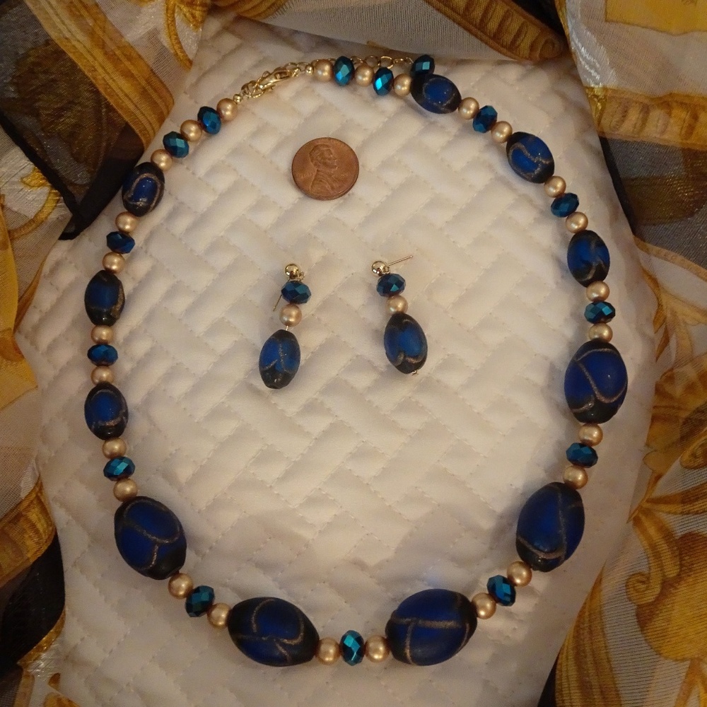 Hand-crafted necklace and earrings in deep blue